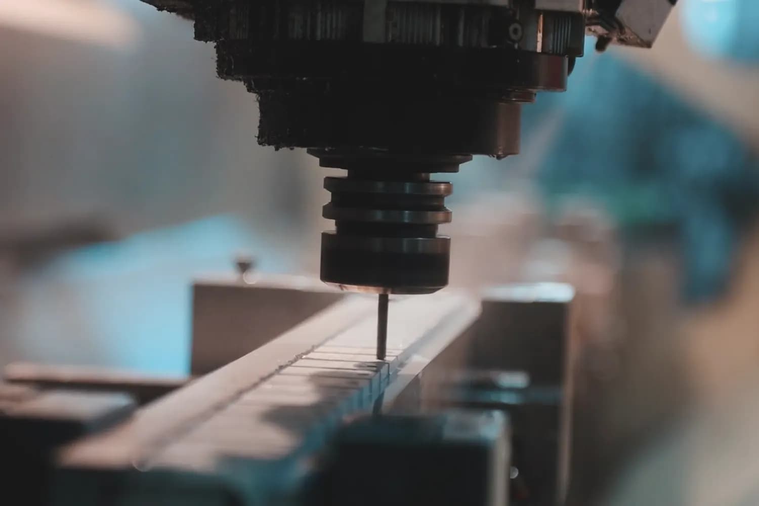 Machine operator at the control panel of a CNC machining centre